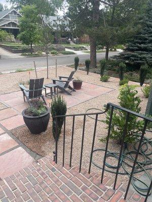 Patio area with pots and water friendly shrubs.