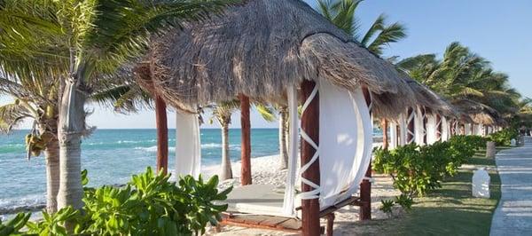 Beach bed and Beach Butler waiting to pamper you at El Dorado Royale, An Adult Only Gourmet Inclusive Resort!!