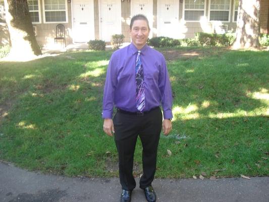 My adorable husband, Bernie, in front of, our apartment, just before a wedding, October, 2015 !! ..