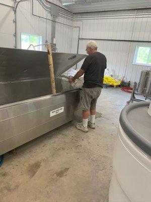 The distiller (Dean) adding grain to a mash