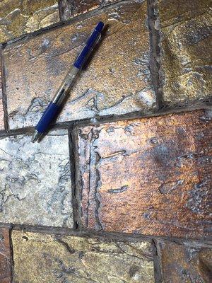 This is a Faux Brick technique used on a backsplash in a kitchen.