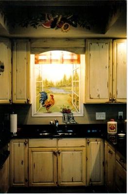 The artist from "34Fourteen Boutique" painted a window with a view over a kitchen sink...