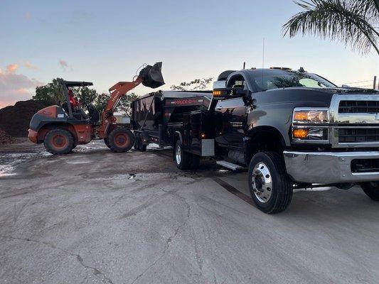 Transporting fill dirt to customers house for landscaping