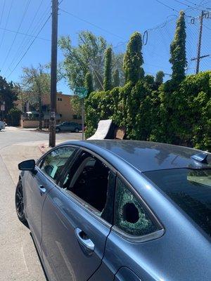 Broken window outside unit. No safety for vehicles