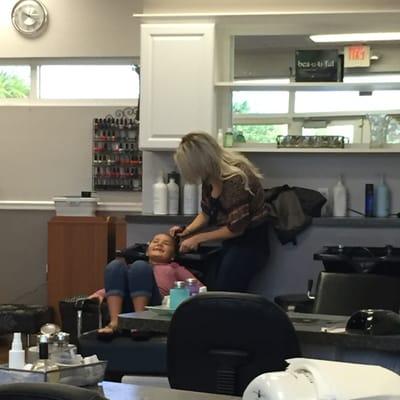 Getting her hair washed before cut... The smile says it all!