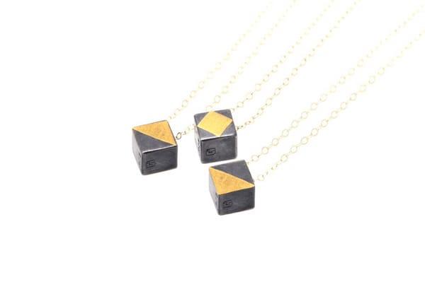 Lux Cube pendants: oxidized sterling silver with 24k gold accents on a solid 14k gold chain. All from recycled and refined materials.