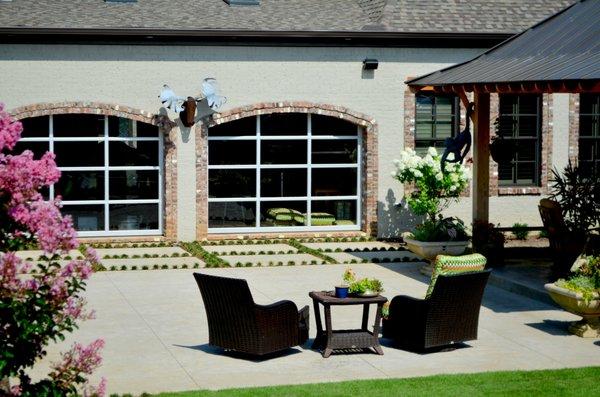 we installed numerous doors for this client, including glass doors from inside the house creating an outdoor kitchen environment.