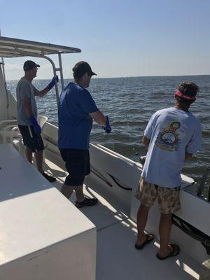 Hooking a crab pot.