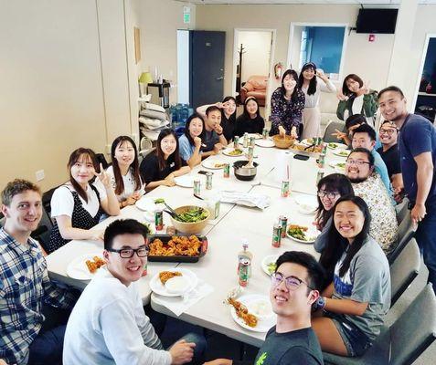 Two international missions teams having a fellowship over lunch in Upper Room