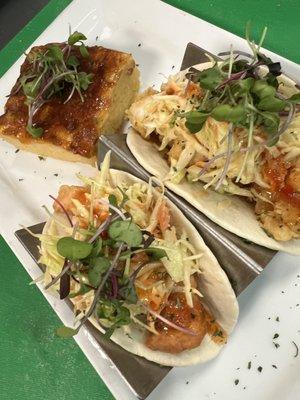 Jam Up Tacos- A choice of crunch, lobster, or salmon bites served in the soft shell taco topped with slaw; drizzled with sweet chili sauce