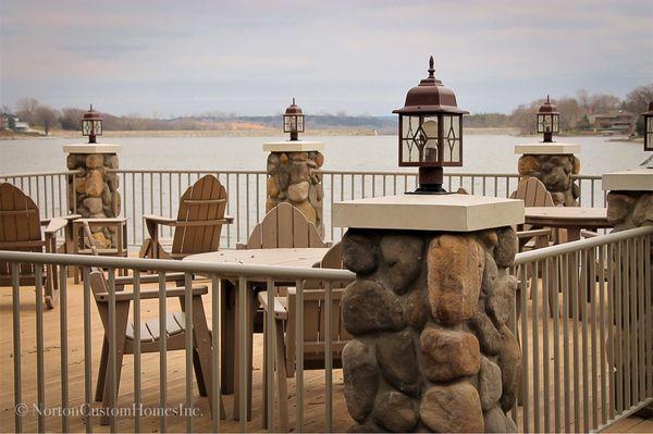 Lake view composite deck, lantern topped stone pillars