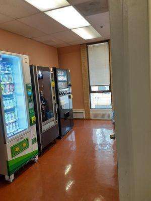 Vending machine room across from dentist office with water, juice, snacks, coffee