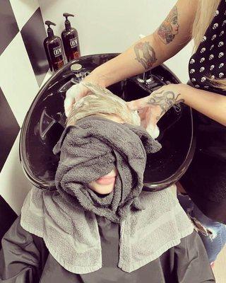 A hot towel shampoo is included with a Men's Cut & Style service