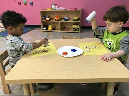 Our toddlers are recycling toilet paper rolls to create stamps!