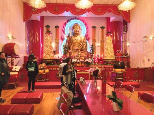 Further into the temple, the enormous Golden  Grand Buddha sits on the large altar. I felt so small infront of him.