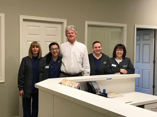 Dr. Michael Maloney posing with some of the medical staff at the allergy and asthma clinic in Gainesville, GA