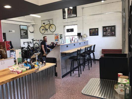 Coffee patrons get to watch whatever work is being performed in the bicycle workstand