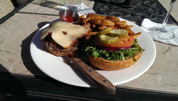 Swiss cheese burger with bacon, $17.50.