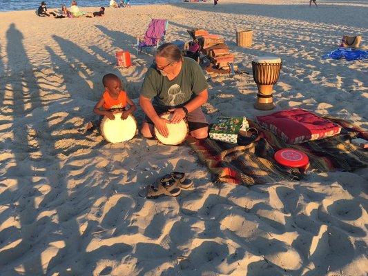 David Elder warming up with a friend next to the bonfire.  Getting ready for full moon yoga!