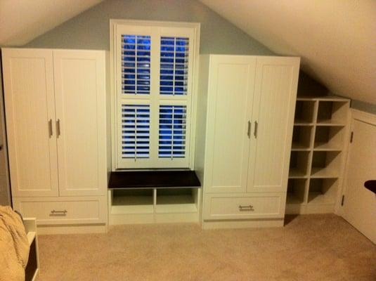 Twin armoire cabinet with hanging, drawer space and adjustable shelving.