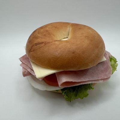 ham bagel sandwich - lettuce, tomato, onion, mayo, mustard & swiss cheese