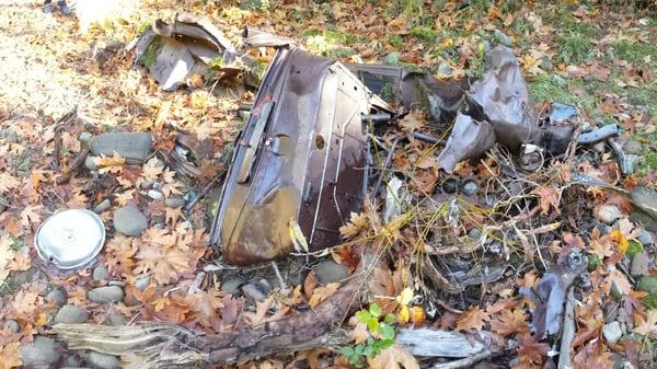 Old jalopy left on the riverbank. A memento from the past.