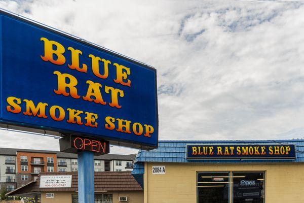 blue rat smoke shop store front from side parking