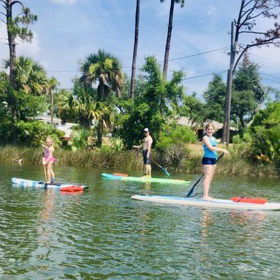 Family paddle boarding lesson