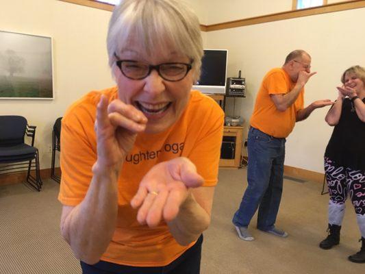 Jan and her husband leading their Laughter Yoga class.