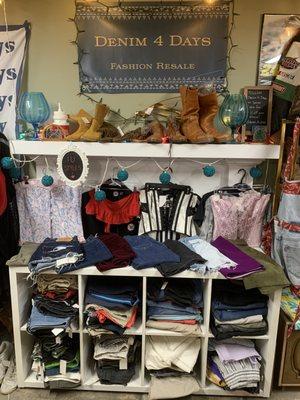 Main view of the booth with shorts, corsets, and boots