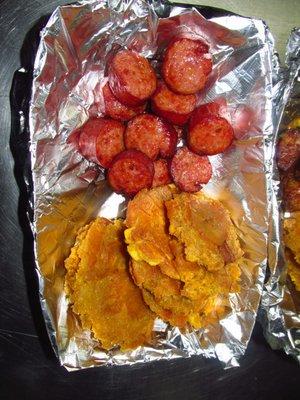 Fried plantain and fried smoked sausage.