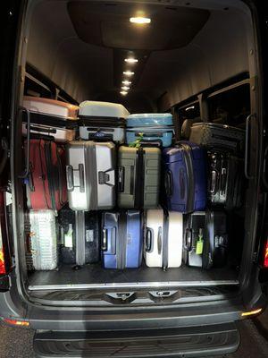 Black Mercedes Sprinter Shuttle holds lots of luggage (14 passengers)