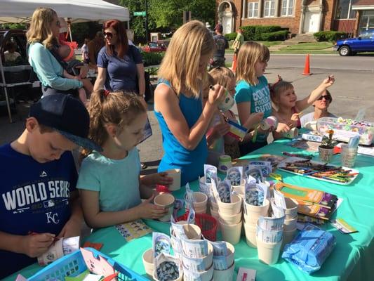 Flower pot painting at the farmers market for the Spring Celebration.