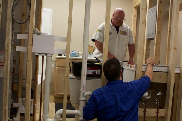 A student learns proper lavatory installation in Total Tech's Plumbing Fundamentals class.