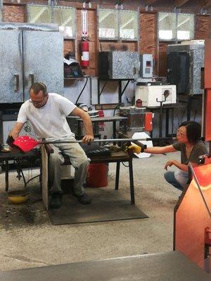 Blowing glass and shaping