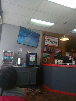 Watching  funny videos on TV at lube express