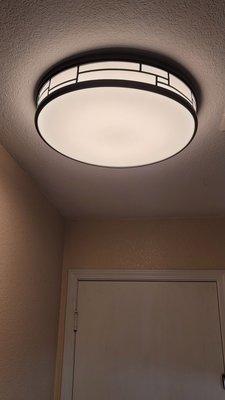 Ceiling lighting fixture Installed in laundry room.