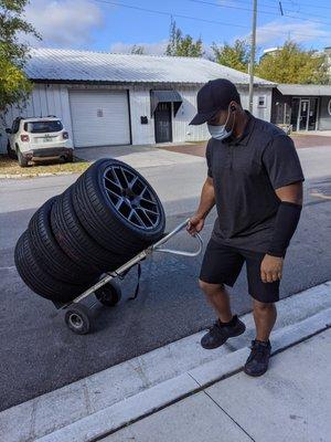 Moving tires on a dolly.