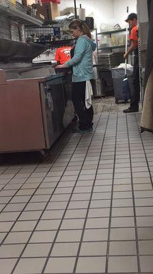 This was the woman who greeted us, touched the trash, and then made our pizza