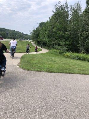 Riding e-bikes up to Charlevoix on the Little Traverse Bay bike trail.