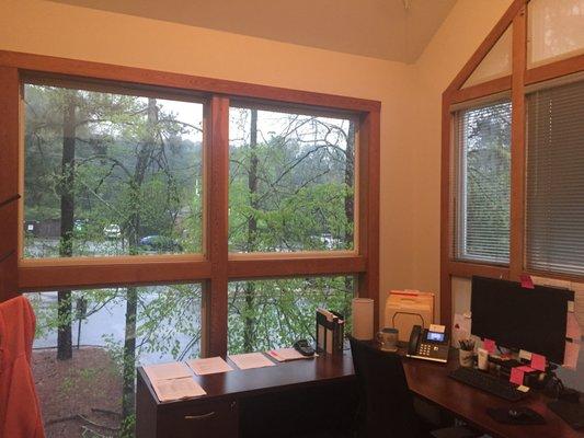 Large windows make for a beautiful office.