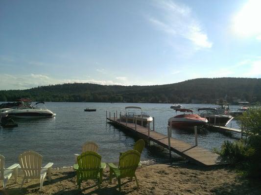 View of Center Harbor on Lake Winnipesaukee from the beach at Lake Shore Motel & Cottages.