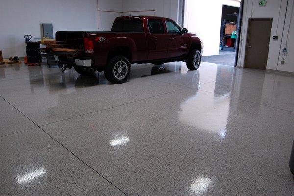 Turned a boring garage concrete slab into a showroom Floor! Epoxy-Polyaspartic Flooring.