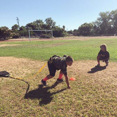 Training my athletes in form and technique for the football season.