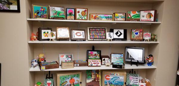 Selection of repurposed boxes with original art.