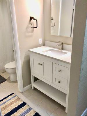 Clean open describes this classic white shaker furniture style cabinet at in Ocean City condo