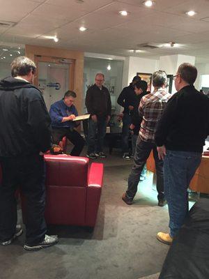 Neal signing and talking with a group that came to see the Gallery.