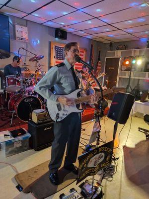 Garrie Woolery of Garrie Woolery and the Backstage Pass performing in his uniform