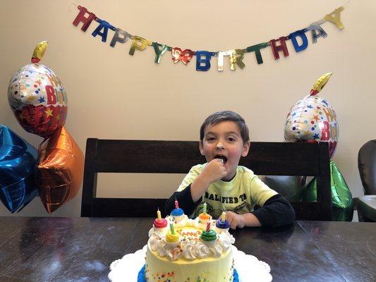 Max enjoying his cake.