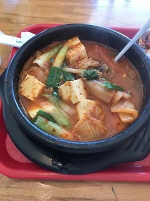 Boodae/Budae Jjigae, beautifully hot & flavorful and made with ripe kimchi, tender tofu & pork.